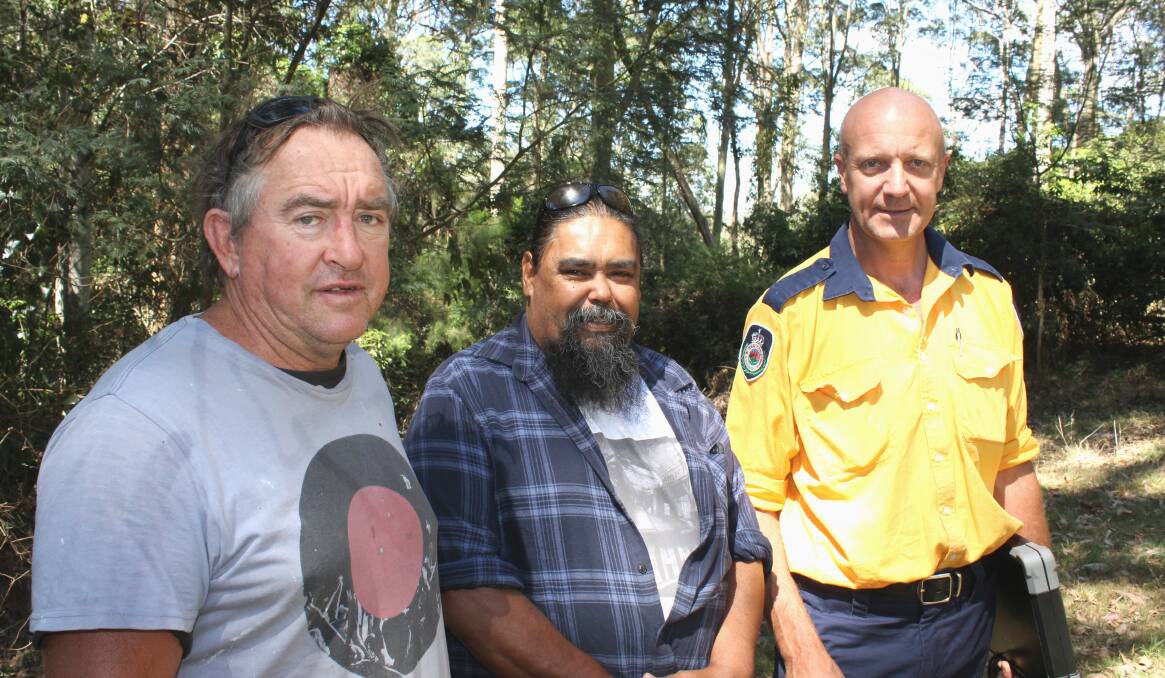 FIRES THE TRADITIONAL WAY: Gary McCarthy, Gary Campbell and Garry Cooper examine the Salty Lagoon Reserve site in Bermagui where a cultural burning is being planned to take place in autumn. 