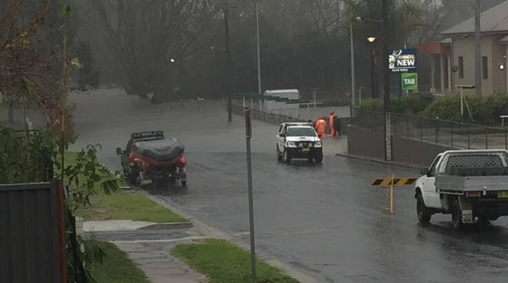ROAD CLOSED: Water had covered the end of Gipps St, Bega and flooded Club Bega's bowling green on Monday morning. 