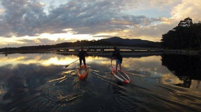 TAKE TO THE WATER: Learn to stand up paddleboard in the pristine Bermagui River during the ReBoot weekend. There is also a range of other activities on offer. 