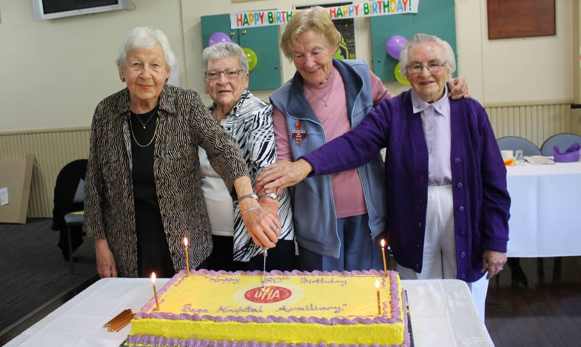 CELEBRATION: The Bega Hospital Auxiliary's longest serving members Vi Sherlock, Betty Rose, Betty Lovelock and Lorna Ringland cut the 80th anniversary cake. 