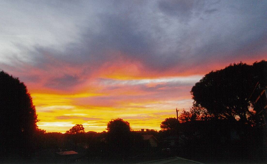 WHAT AMAZING COLOURS: Betty Lovelock recently took this stunning photo of a sunset from her back veranda on Glebe Avenue, Bega.