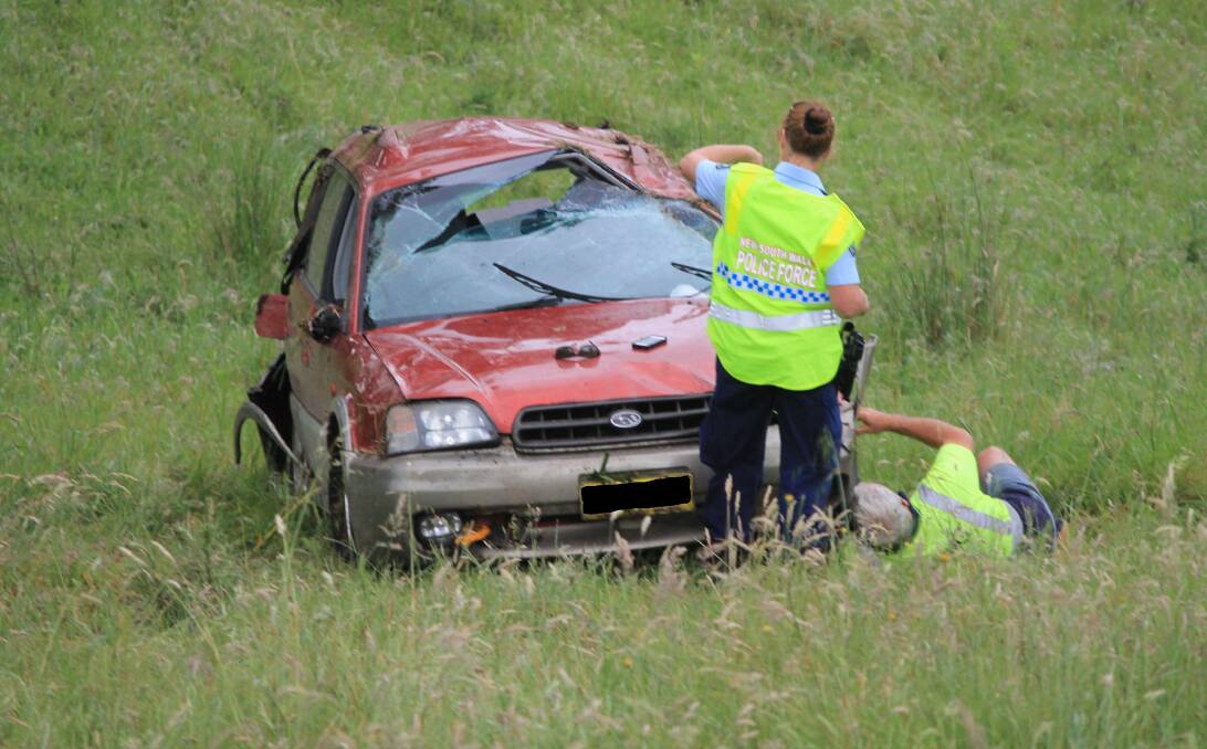 DAMAGE: This car rolled down a hill just south of the Bega lookout on Thursday, coming off a notorious site on the Princes Hwy. Picture: Albert McKnight