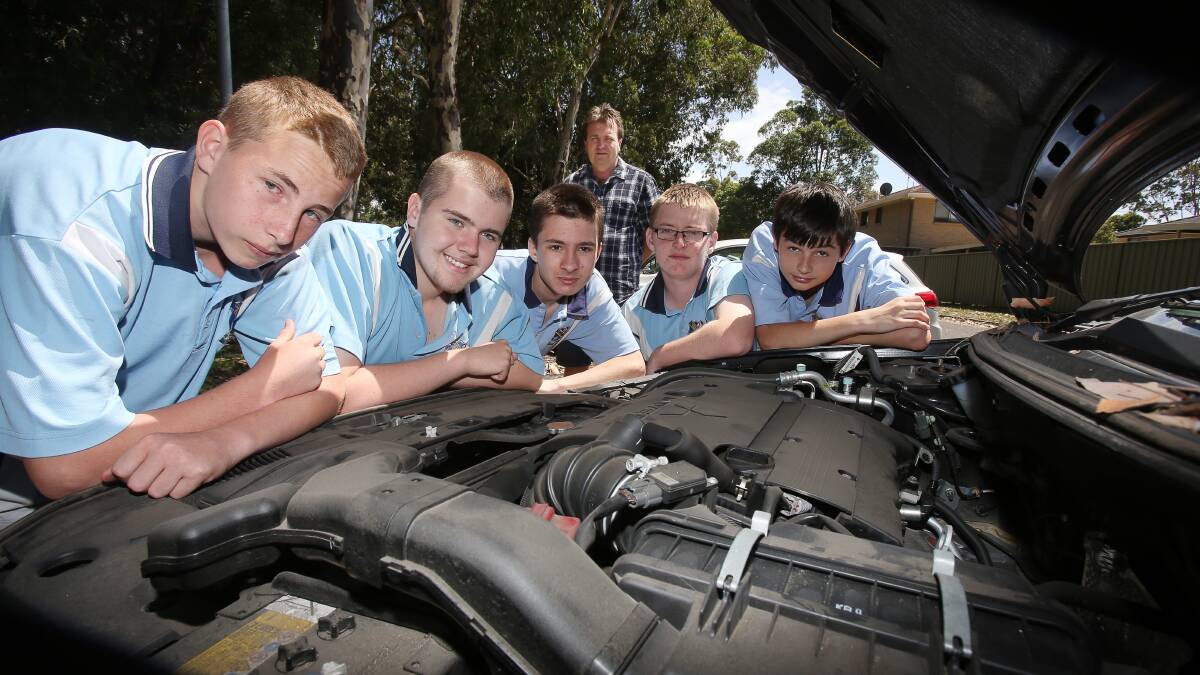 Lake Illawarra High teacher Martin Moore with students Shay Taylor, Zeb Hepburn, Bill Moon, Shae Foster and Josh Selby. They'll be joining students from 100 NSW schools for a day of fun learning at the V8 Supercars, Sydney Olympic Park. Picture: Robert Peet