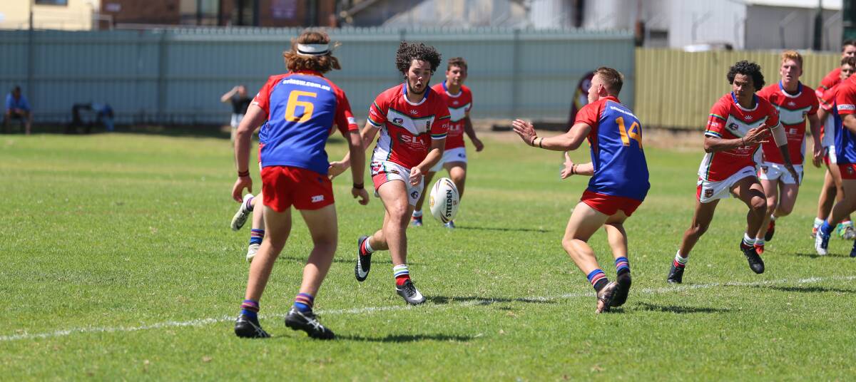 League support: Bega's Callum Bower-Scott puts a grubber between two defenders in the opening round of the Laurie Daley Cup in Bega. CRL will donate this week's gate takings to the Mayoral Fund. 