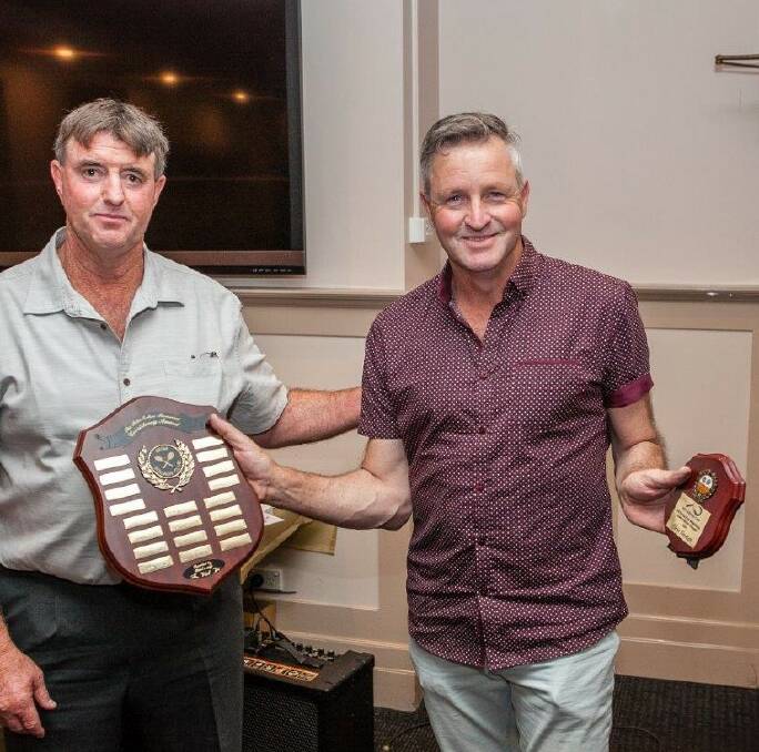 Consistent: Chris Bartlett accepts the Peter Eaton Memorial Award from Robert Blacker which recognised his work both on and off the courts. 