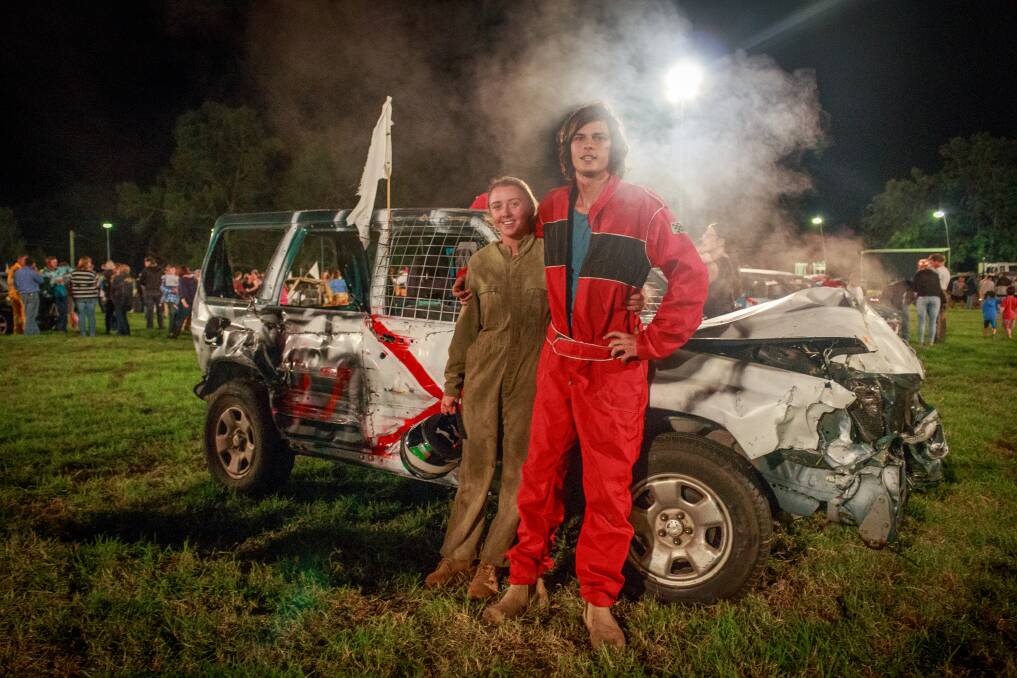Wrecking ball: Sonya Matthews and Kane Wilson are happy with their efforts next to Sonya's Subaru Forester after the Bega Show's demolition derby. 