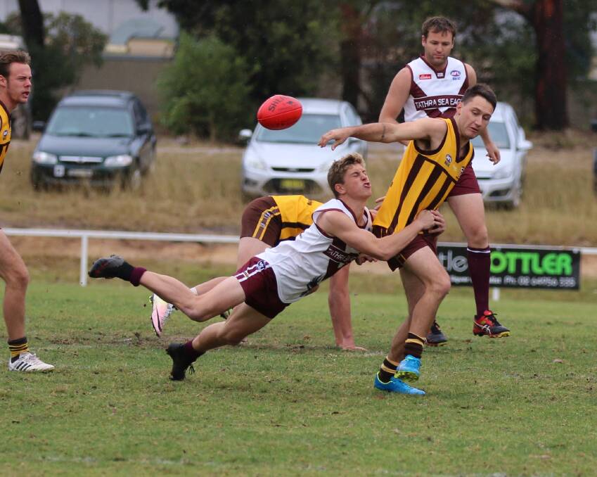 Tackle: A Tathra Sea Eagle launches a flying tackle on one of the Pambula Panthers during a recent clash, with Pambula scoring a tight win on Saturday. 