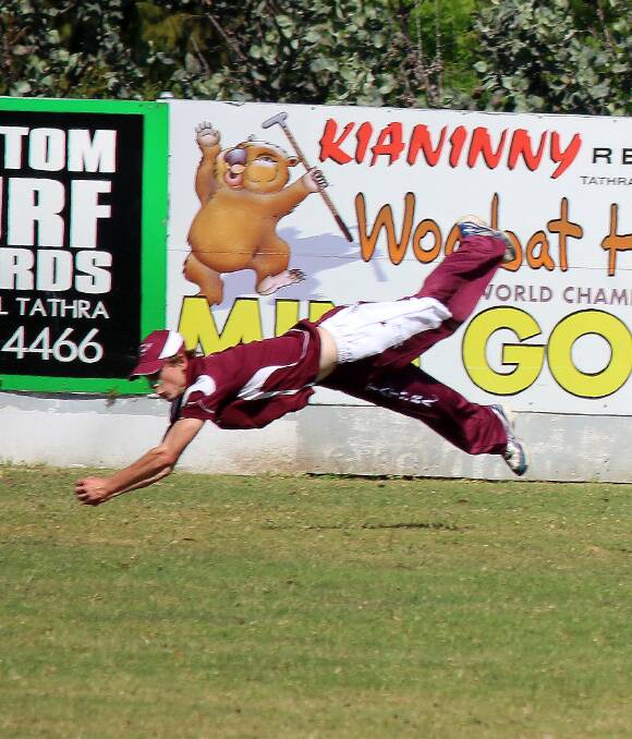 Airborne: Tathra cricketer Chris Dwyer takes the wicket of Pambula Bluedogs batsman Tom Hammond late in the first innings of the one-dayer on Saturday. Picture: Jacob McMaster