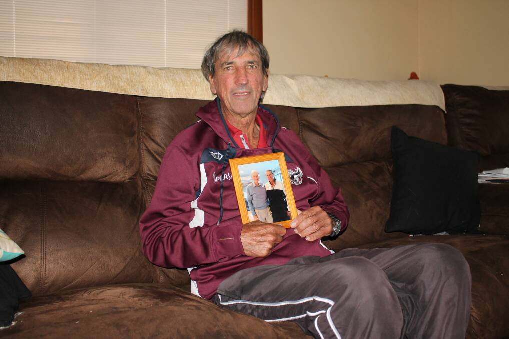 Cricket tragic: Local sporting identity Dick Blacka with a photograph taken during his recent meeting with former Australian cricket captian Bill Lawry.