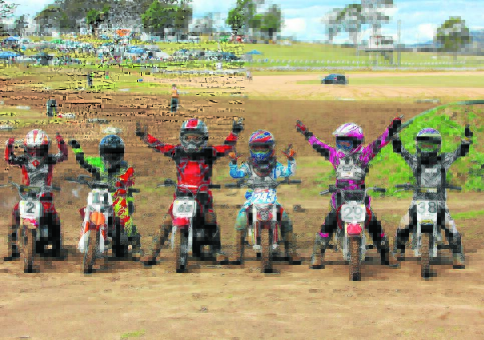 Junior riders throw their arms up to celebrate a recent meet at the FSC Motorcyle Club with the next meet to be held on August 7. 