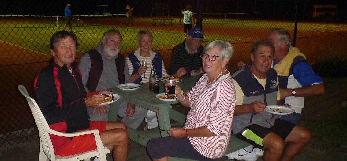 Friendly competition: Tathra tennis players enjoy a barbecue during a round last year and the club is seeking more players to join this season. 