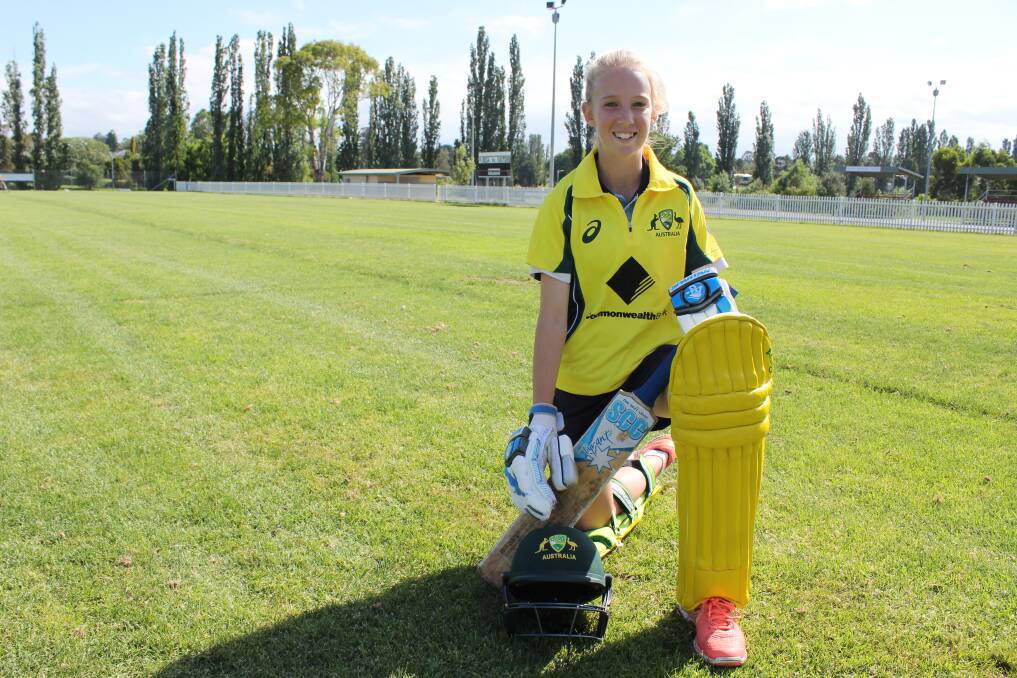National contender: Cobargo's Jade Allen in the gold Australian playing strip she will wear as part of the Cricket Australia XI under 15s next week. 