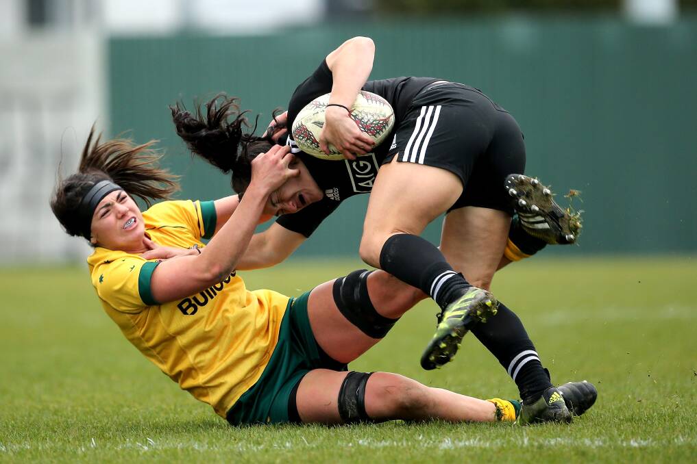 WORLD CUP DEBUT: Cobargo's Millie Boyle tackles  Portia Woodman of the Kiwis during the Four Nations and has just been announced in the World Cup roster. 