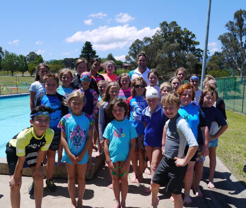 Three-time Australian water polo Olympian Richie Campbell gives pointers to swimmers from the Bemboka Public School this week. 