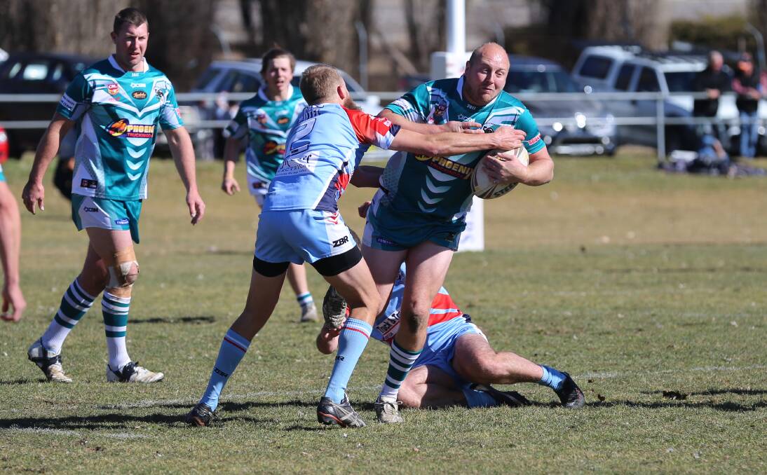 Strong run: Trent Rollason crashes through a Bega tackle attempt during the reserve grade final at Cooma on Sunday. 