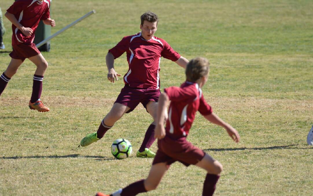 Middle play: Kamish Threadgate controls the ball ready to slide a pass through in attack for Tathra. Picture: Steve Sass. 