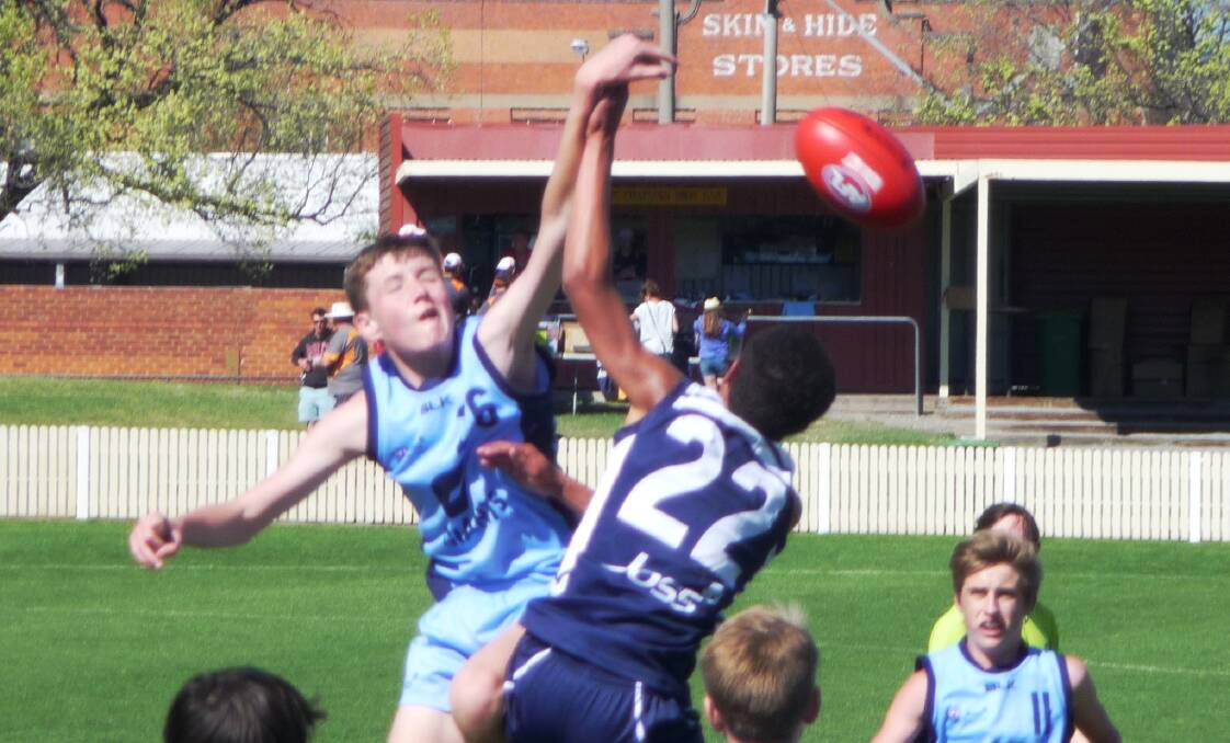Ruck contest: Pambula Panther Flynn Cook takes on Aidan Adams during state Aussie rules trials last week. Picture: Supplied