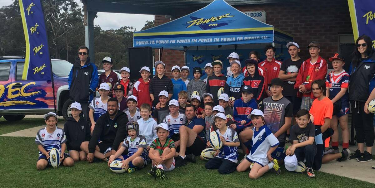 Great turnout: entrants in the Power FM Footy Boot Camp celebrate with NRL players after  the session in Pambula on Tuesday. Picture: courtesy Power FM