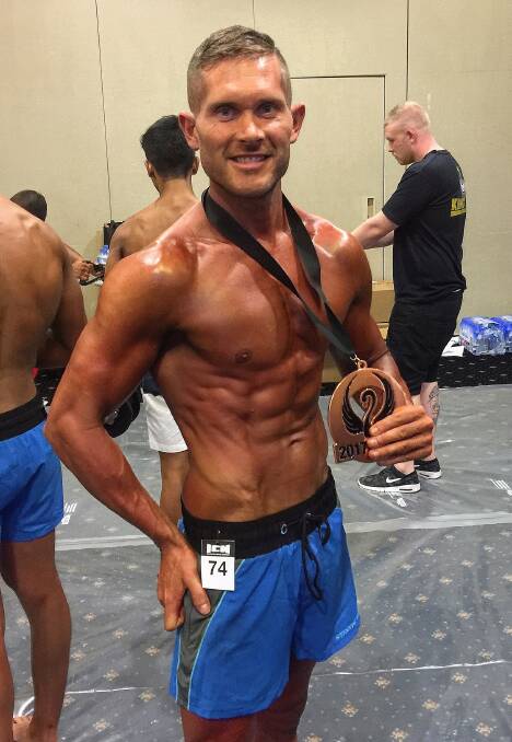 Shaping up: Clay Ryan displays his bronze medal from the ACT bodybuilding titles round and is excited to chase his pro card in Sydney this weekend. 