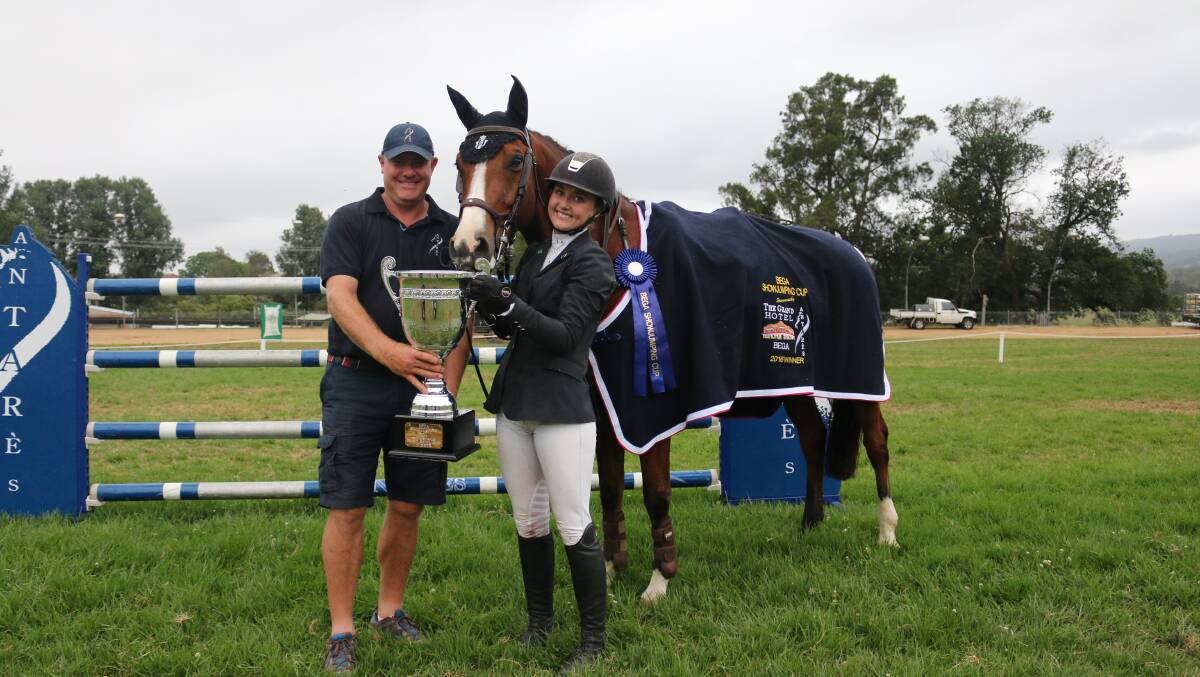 Coveted Cup: Jamie Smith from Antares Australia presents the Bega Showjumping Cup to Jamie Priestley and KS Optimus on Saturday night. 