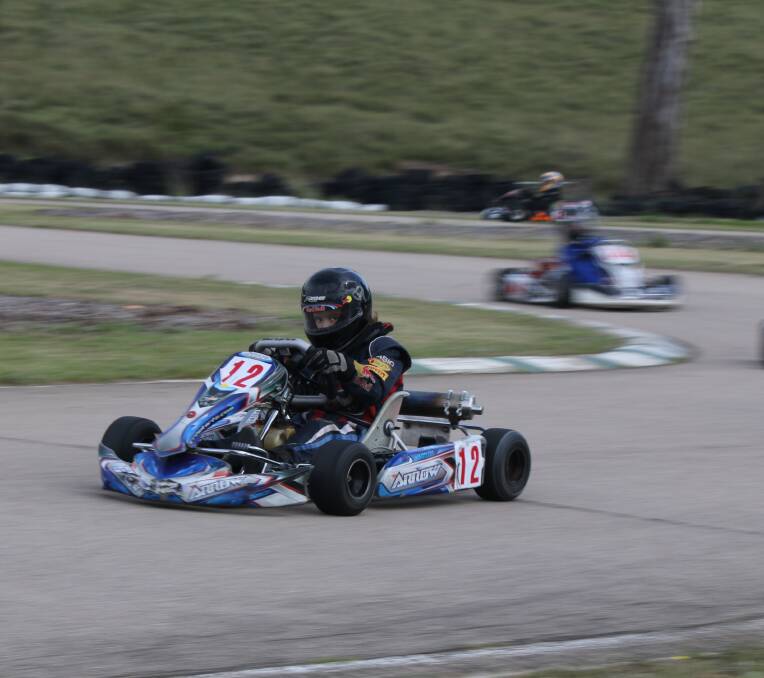 Cadet racer: Brad Parker shows some thrilling pace through the centre sections of the Frogs Hollow track. 
