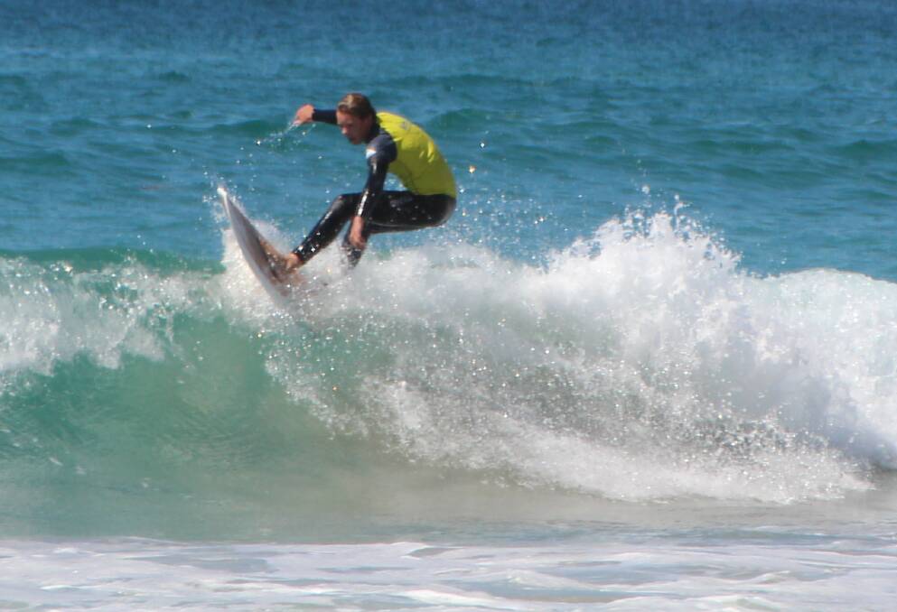 Riding the lip: A Sapphire Coast Boardrider member cruises across the peak of a wave during a recent competition. 