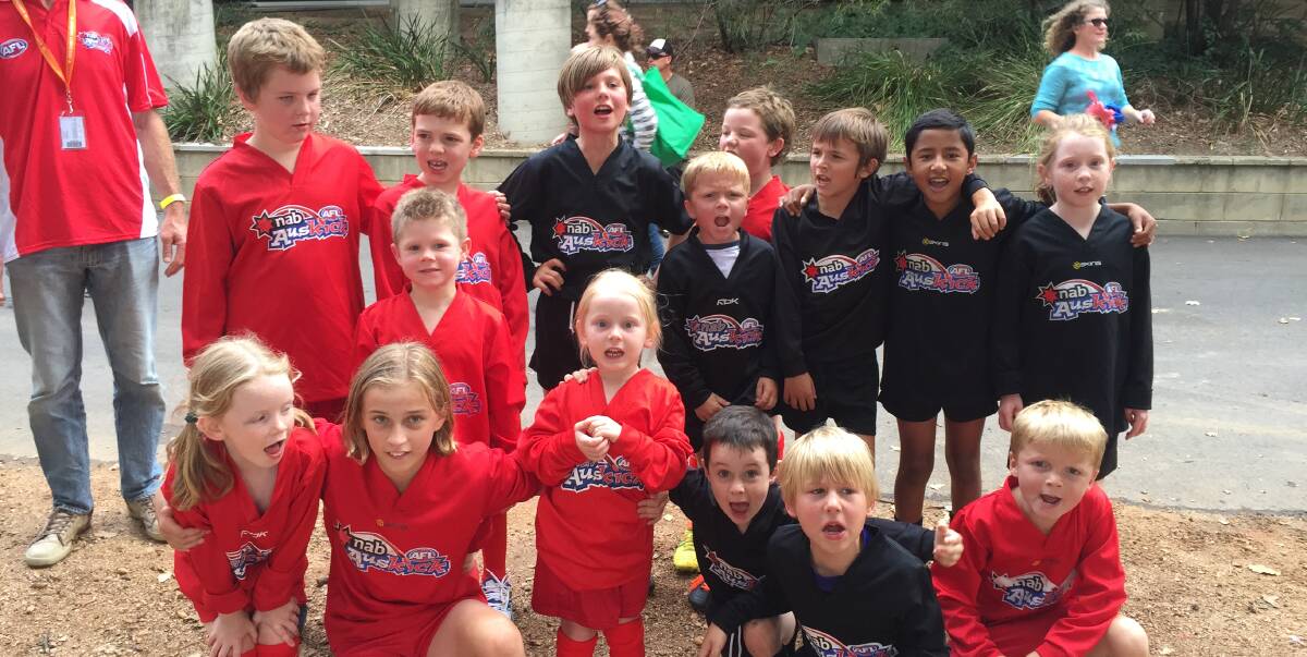 Highlight: Auskick juniors celebrate during a visit to Canberra in April this year with two Bega teams invited to play next weekend. 