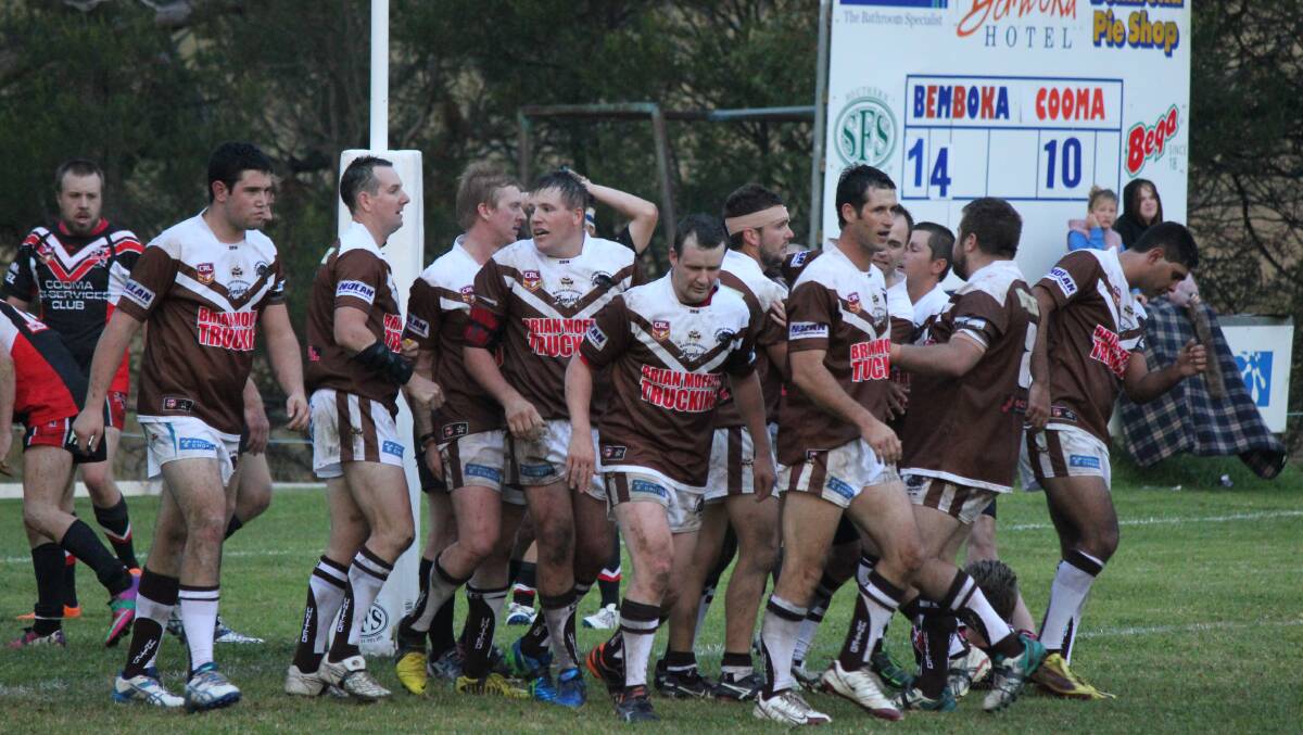 Chocolate soldiers: Candelo-Bemboka celebrate a try during a heritage round in their return 2014 season with anniversary celebrations to run on July 15. 