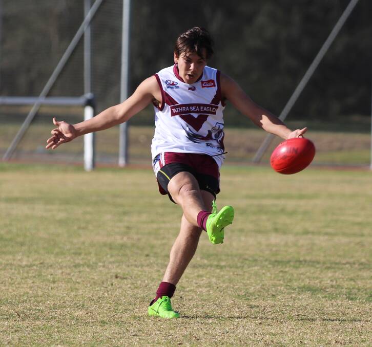Strong in front: Dennis Paratene fires a kick forward during a three-goal performance against the Merimbula Diggers on Saturday. 