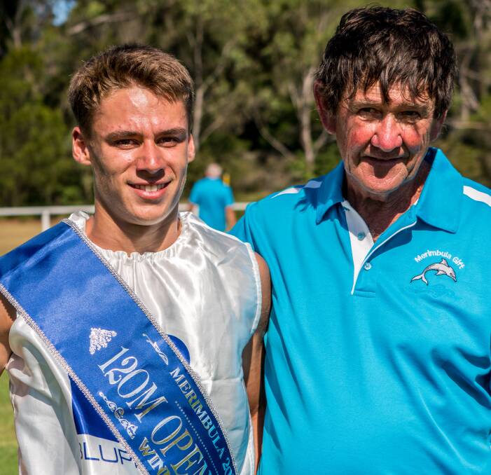 A gifted runner: Merimbula Gift winner Michael Hanna is congratulated by committee president Ian Lloyd after taking out the 120-metre main event in 12.62 seconds. Picture: courtesy Helen Rushton