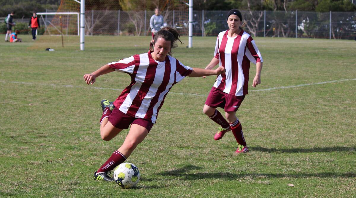 A pair of Tathra ladies players clear the ball out in defence during a recent round with Tathra getting over Bemboka on Sunday. 