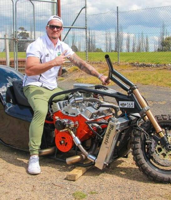Horsepower: Matt Cooper checks out Bega league coach Jason Whitby's custom built sand drags race bike during his visit to Bega last week and hopes to return soon to catch up for a ride.  