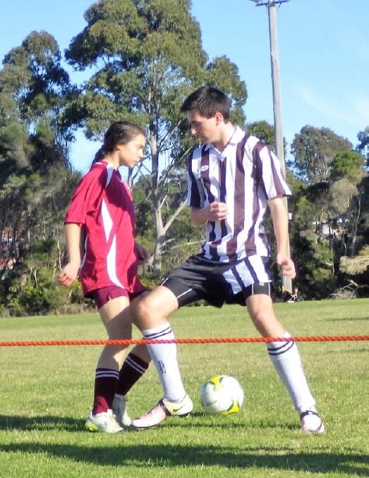 Footwork: Tathra junior Isabel Bellicanta defeats her Eden opponent in a ball contest on Sunday. Picture: supplied.