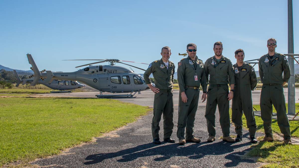 Flight crew of 723 Squadron make a pitstop at the Merimbula airport to refuel after a series of Anzac Day ceremony fly-overs on Monday. 