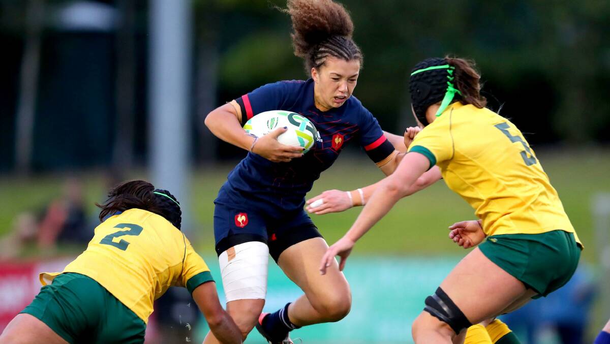 France's Caroline Drouin tries to break through the Australian defence of Cheyenne Campbell and Millie Boyle in their Women's Rugby World Cup 2017 Pool C match at UCD Bowl in Dublin, Ireland, on 13 August. Photo: INPHO/Bryan Keane.
