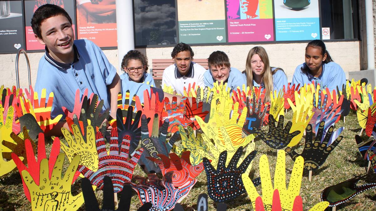 SEA OF HANDS: Bega High School Students Joven, Tamara, Nicholas, Cody, Hayley and Rani outside the Bega Valley Regional Galley on Thursday as part of National Reconciliation Week. Picture: Alasdair McDonald