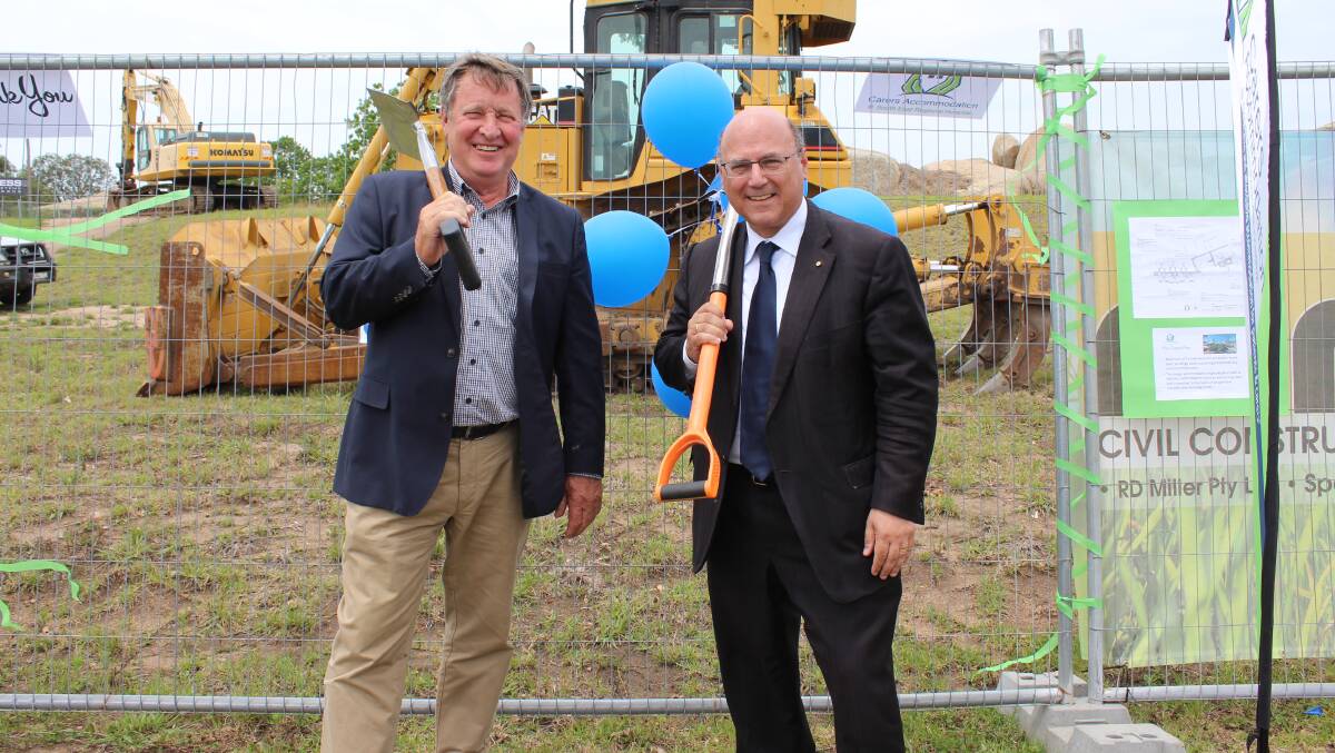 PRIVATE AND PUBLIC: Bega Cheese's Max Roberts with Liberal Party Senator Arthur Sinidinos at the ceremonial turning of the first sod at the regional hospital's carers accommodation site on Thursday. Picture: Alasdair McDonald.