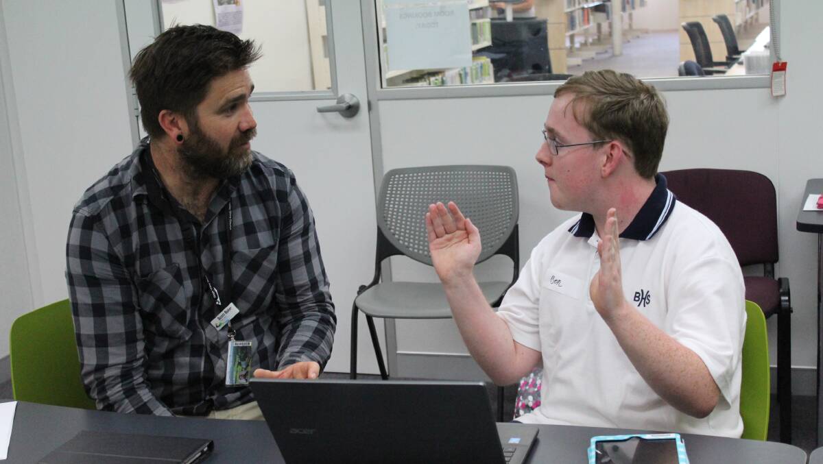 AWARD WINNING: Autism Lab participant Ben Bowyer with Library Programs and Partnerships Officer Scott Baker in February this year. Picture: Alasdair McDonald