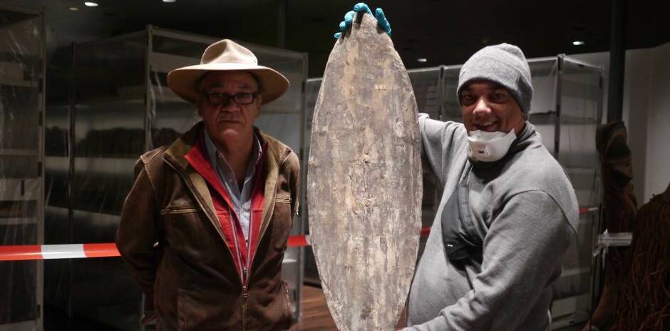 MIXED EMOTIONS: Rodney Kelly (right) and Vincent Forrester stand with the shield found in Berlin’s Ethnological Museum. Picture: Dylan Wood