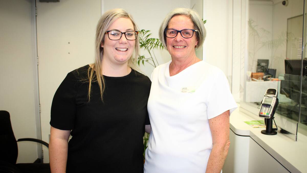 New St. George Bank branch manager Brie-Anna Dowdell with retiring manager Julie Lay on Wednesday. Picture: Alasdair McDonald 