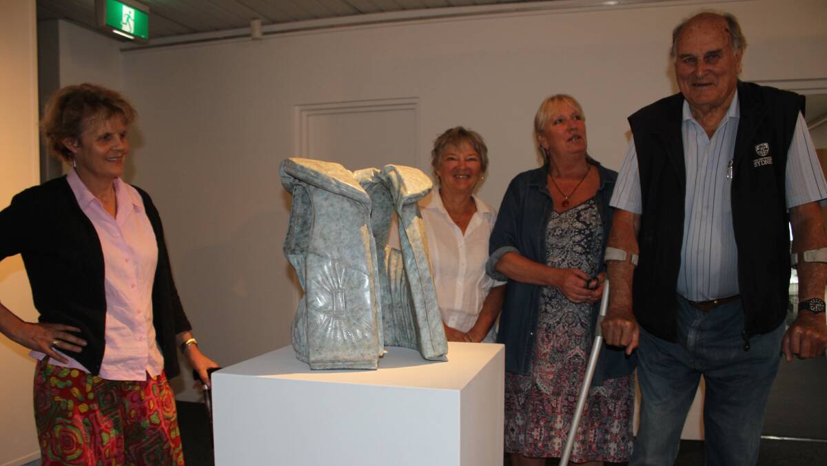 Susie Larridd, Gayl Cox, Deb Morgan and Bob Weston next to Alex Seton’s 2014 work titled Life Vest (Emergency). Picture: Alasdair McDonald