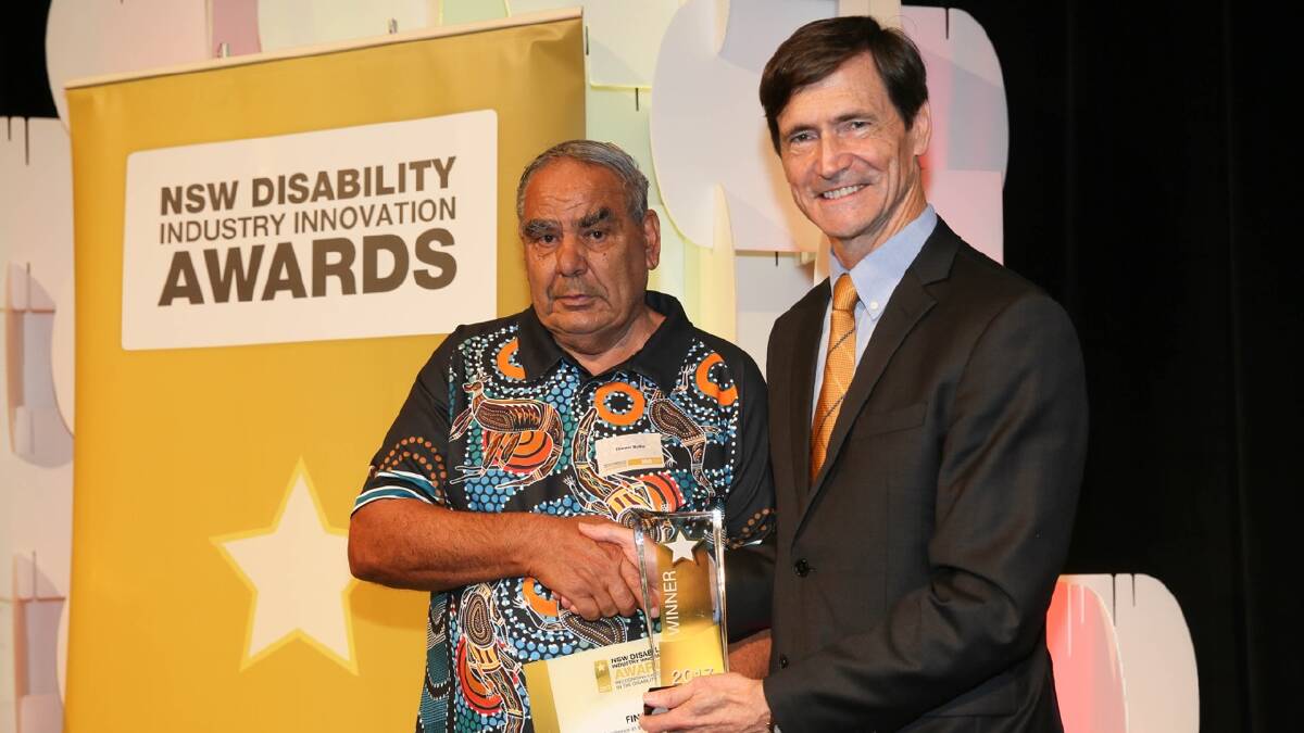 INNOVATING: Bega's Thomas Butler receiving his award from Deputy Secretary for Ageing, Disability, and Home Care at the Department of Family and Community Services Jim Longley. Picture: Supplied