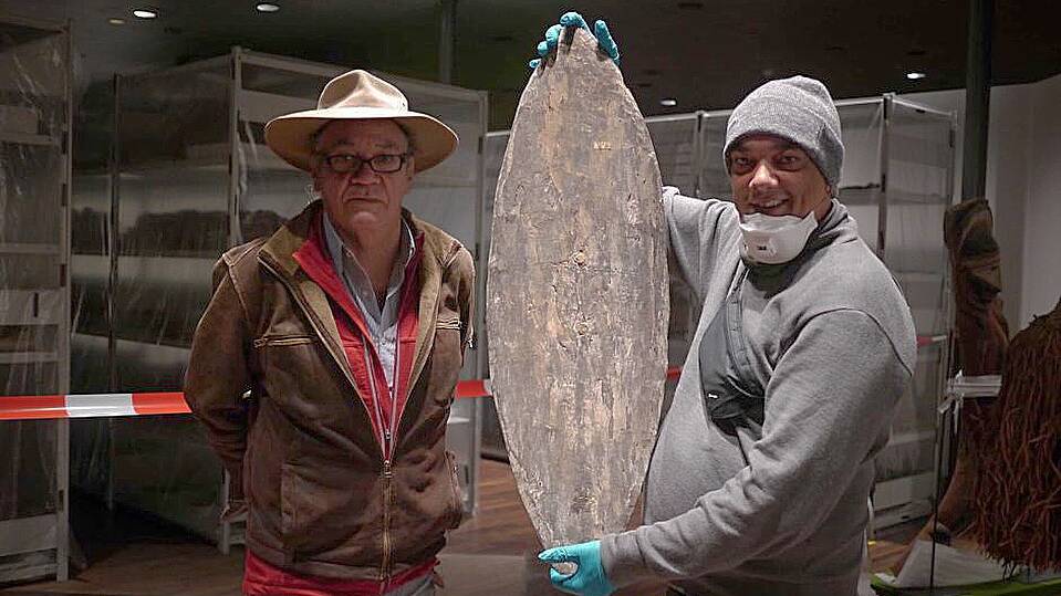 Rodney Kelly (right) and Vincent Forrester stand with the shield found in Berlin’s Ethnological Museum. Picture: Dylan Wood