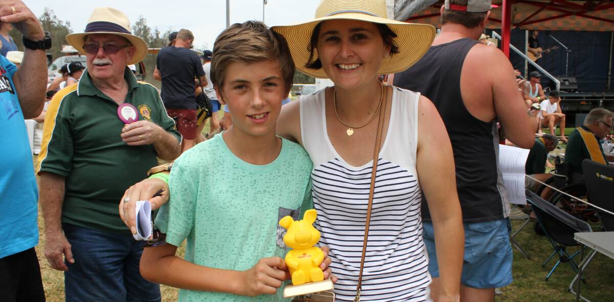 FAMILY FUN: Alina Matterson of Pambula, with her son Connor, after her win in Race 2 of the Tathra Lions Club Pig Races on Sunday.