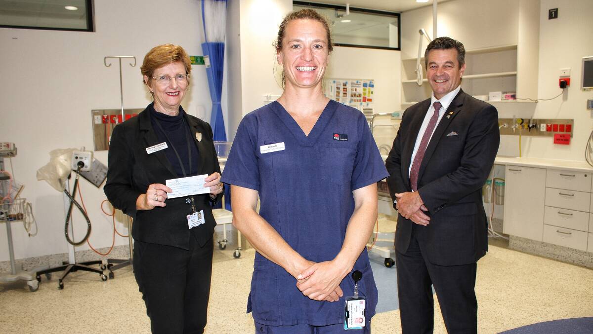NEWBORN HELP: Hospital general manager Wendy Hubbard, midwife Hannah Bird and Peter Cursley in the neonatal ward on Friday.