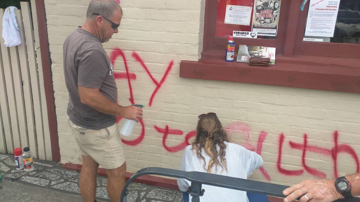 TOWN PRIDE: The Cobargo community comes together on Monday after the town's post office was vandalised. Picture: Supplied