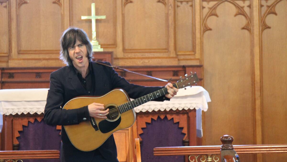 NEW FORMAT: Candelo musician Heath Cullen plays inside the town's church for Candeloha during the 2015 Candelo Village Festival. Picture: Albert McKnight