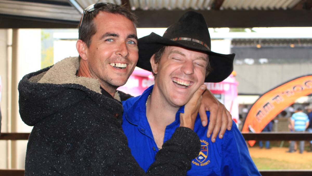 SHOWTIME: Bega's Robert Motbey and Patrick Salway enjoy thier favoourite part of the Cobargo Show, watching the bull riding. Picture: Melanie Leach