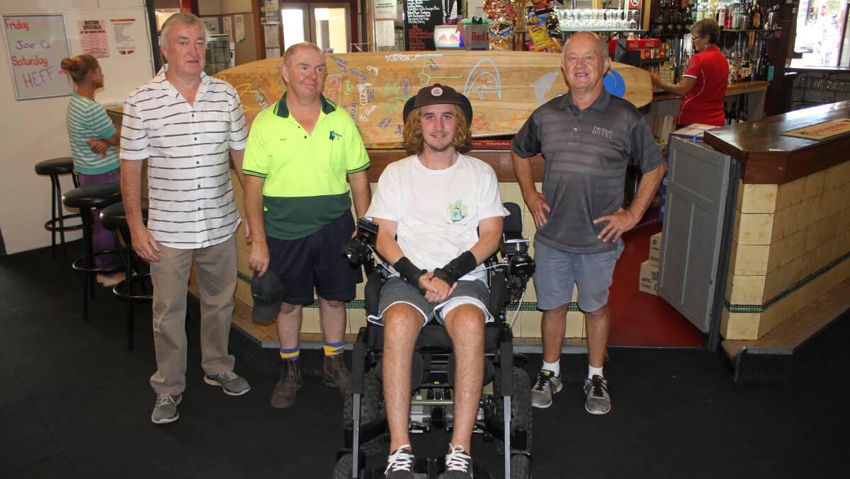 HELPING HAND: Bega Roosters president Garry Ahkin, Ray Ringland and Peter Turner present $5000 to Jason Apps after the recent fundraiser at Bega's Grand Hotel. Picture: Alasdair McDonald