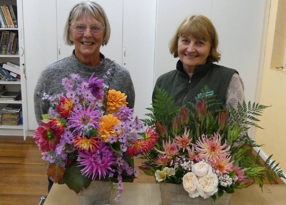 Beautiful work: Annette Scanlan and Diane Crooks with their winning floral arrangements.